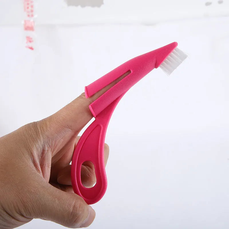Red and white finger sleeve toothbrush for dog and cat dental care on a blue background.