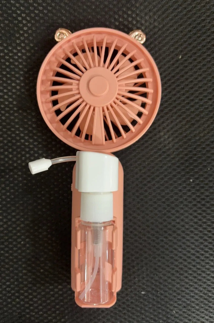 Small plastic nozzle fan in apricot colour with USB charging port