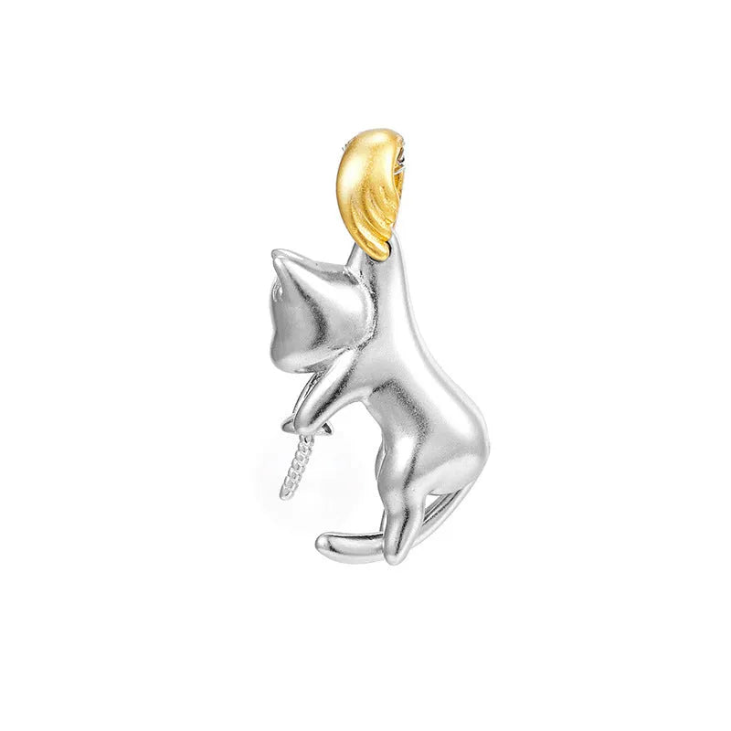 Close-up of a sterling silver cat charm clavicle chain necklace on a model.