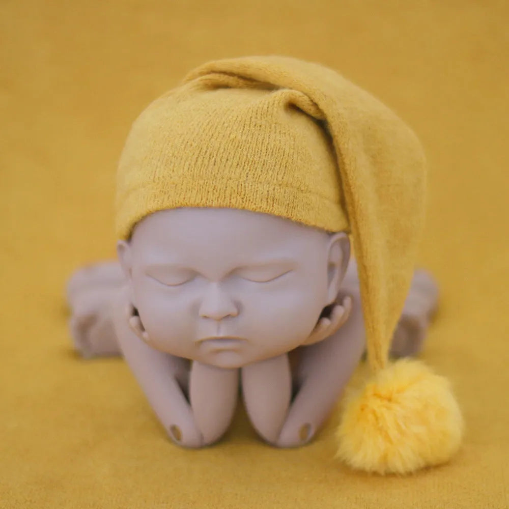 Hand-woven yarn baby photography hat in conical style, available in twelve colour options