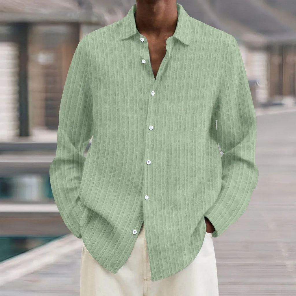 Man wearing a loose fit striped cardigan shirt in British style with a 3D pattern.