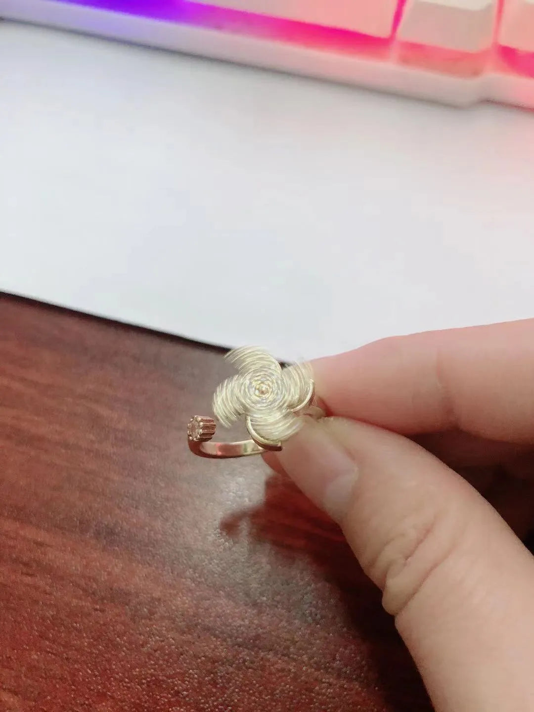 Rotating copper ring with geometric windmill design in gold or silver electroplate