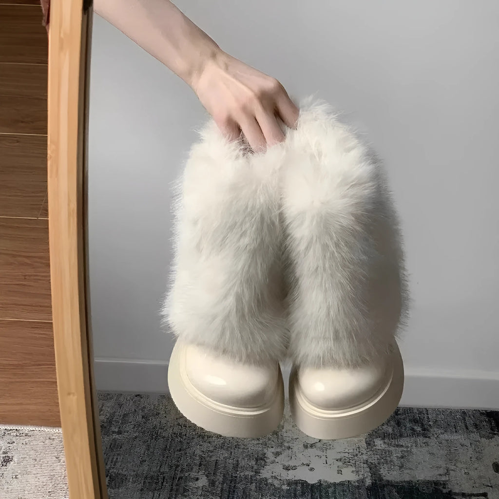 Women's black fleece-lined snow boots with waterproof platform and mid heel