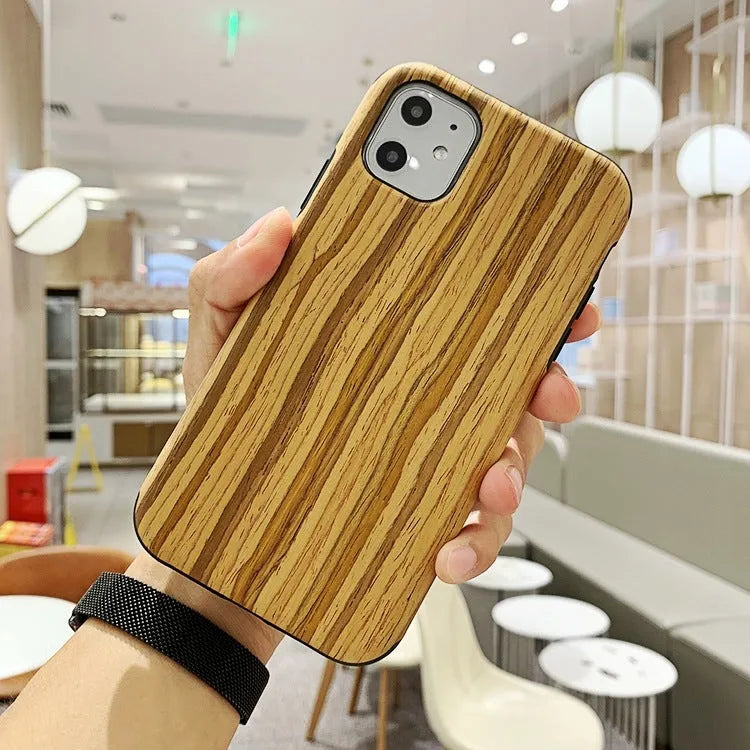 Wooden iPhone case with natural wood grain showing rosewood finish on iPhone 11 Pro
