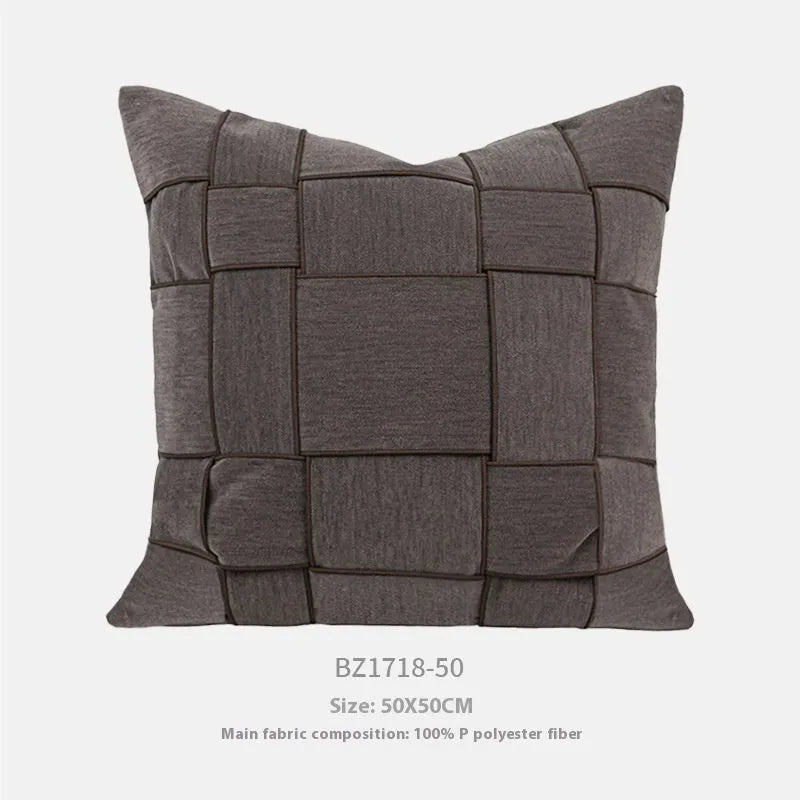 Square chenille woven cushion in beige colour on a grey sofa, 50x50cm size.
