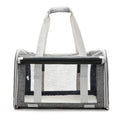 Outdoor portable pet bag in black with transparent panels and mesh sides, folded and shown next to a cat