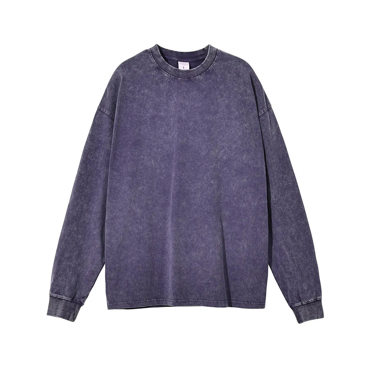 Man wearing a loose fit batik black washed vintage cotton long sleeve pullover.