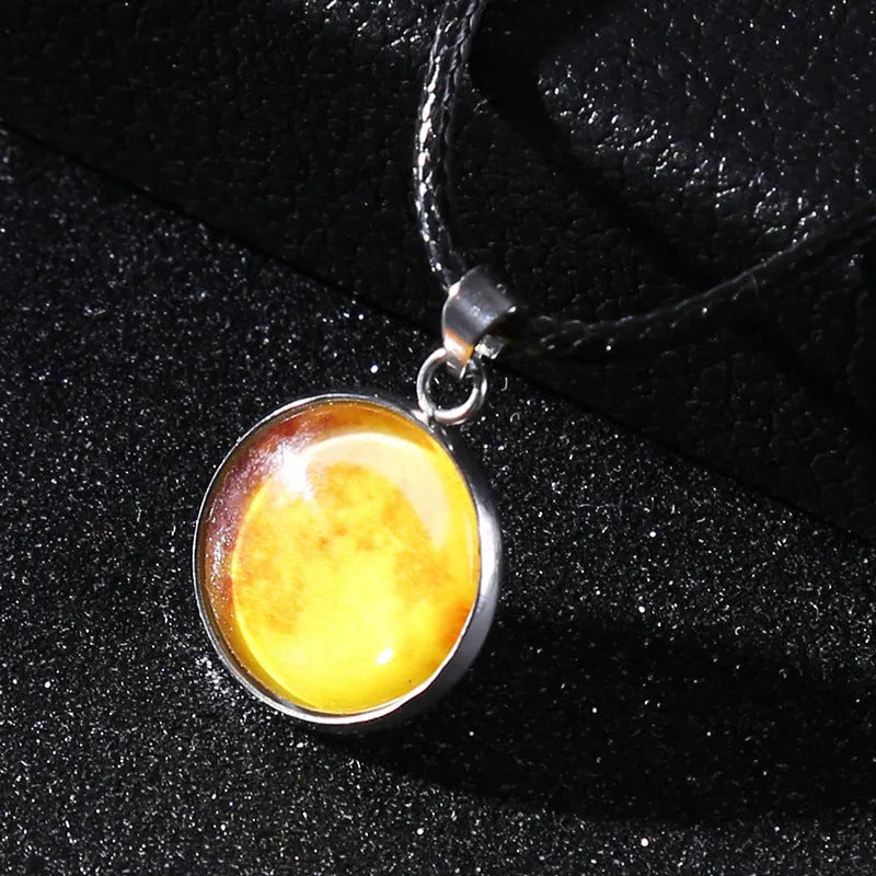 Luminous constellation pendant necklace with adjustable chain on a plain background.