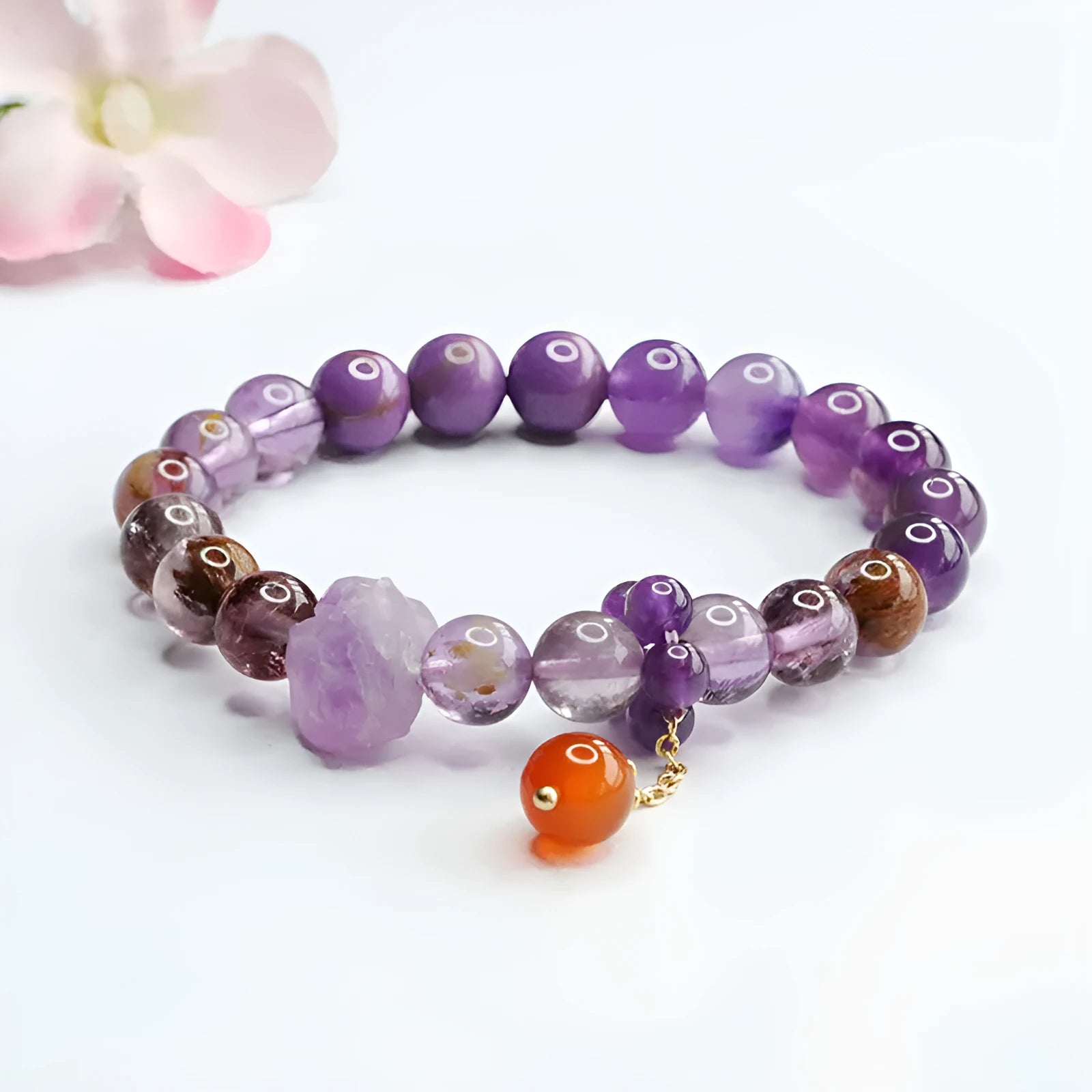 Purple amethyst crystal bracelet with red agate stones measuring 8mm beads