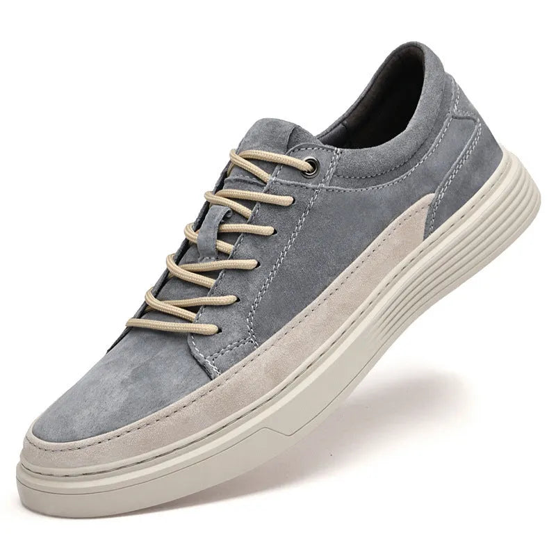 Men's grey casual skate shoes with pigskin upper and rubber sole showing lace-up front design