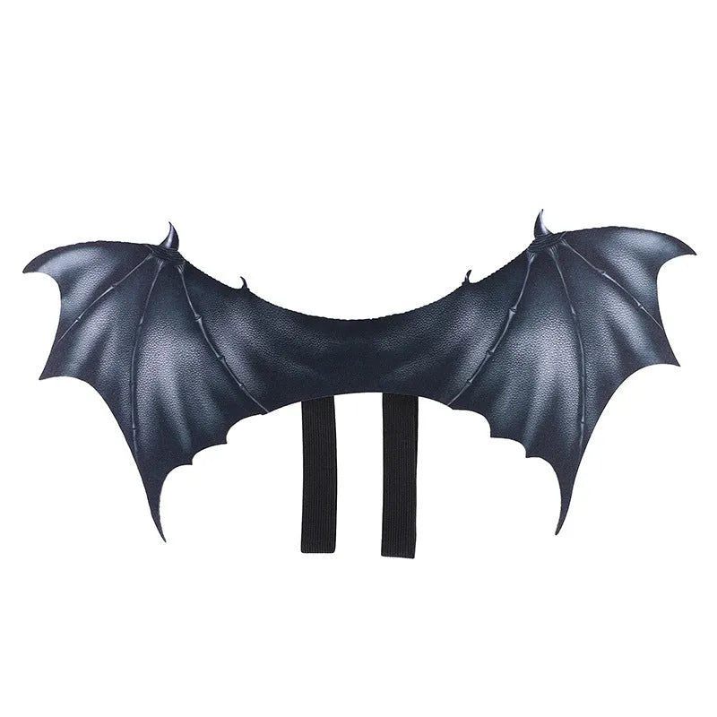 Black fabric bat wing costume for a pet dog or cat, showing elastic straps.