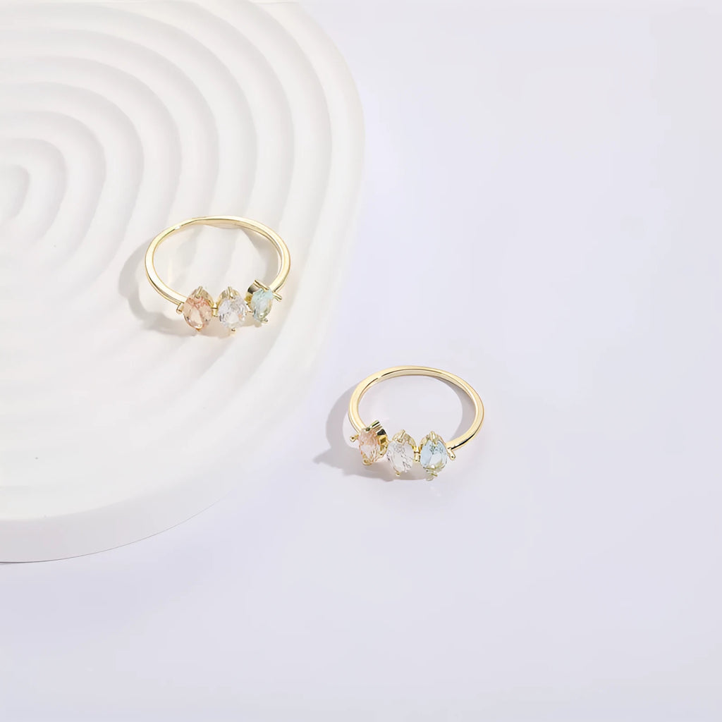 Geometric triangle ring with tricolour zircon stones in horse eye pattern and gold colour finish