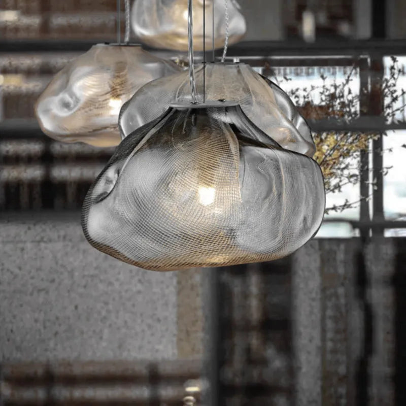 Modern fabric-style glass LED chandelier with clear, amber, or smoke grey shade, shown in small and large sizes.