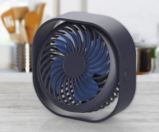 USB desk fan with rotating head in modern alarm clock design on desk