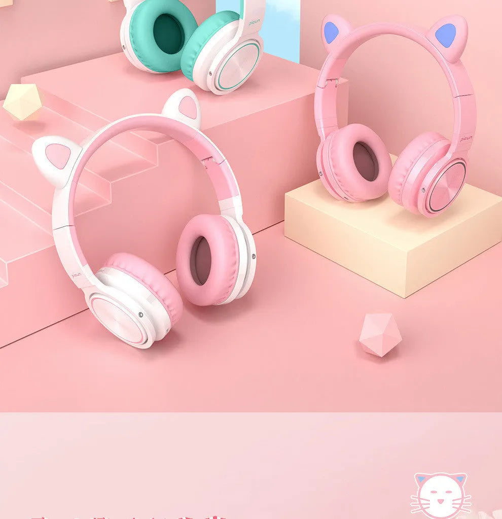 Pink white Luminous over-ear Bluetooth headset with braided wire and large ear cushions.