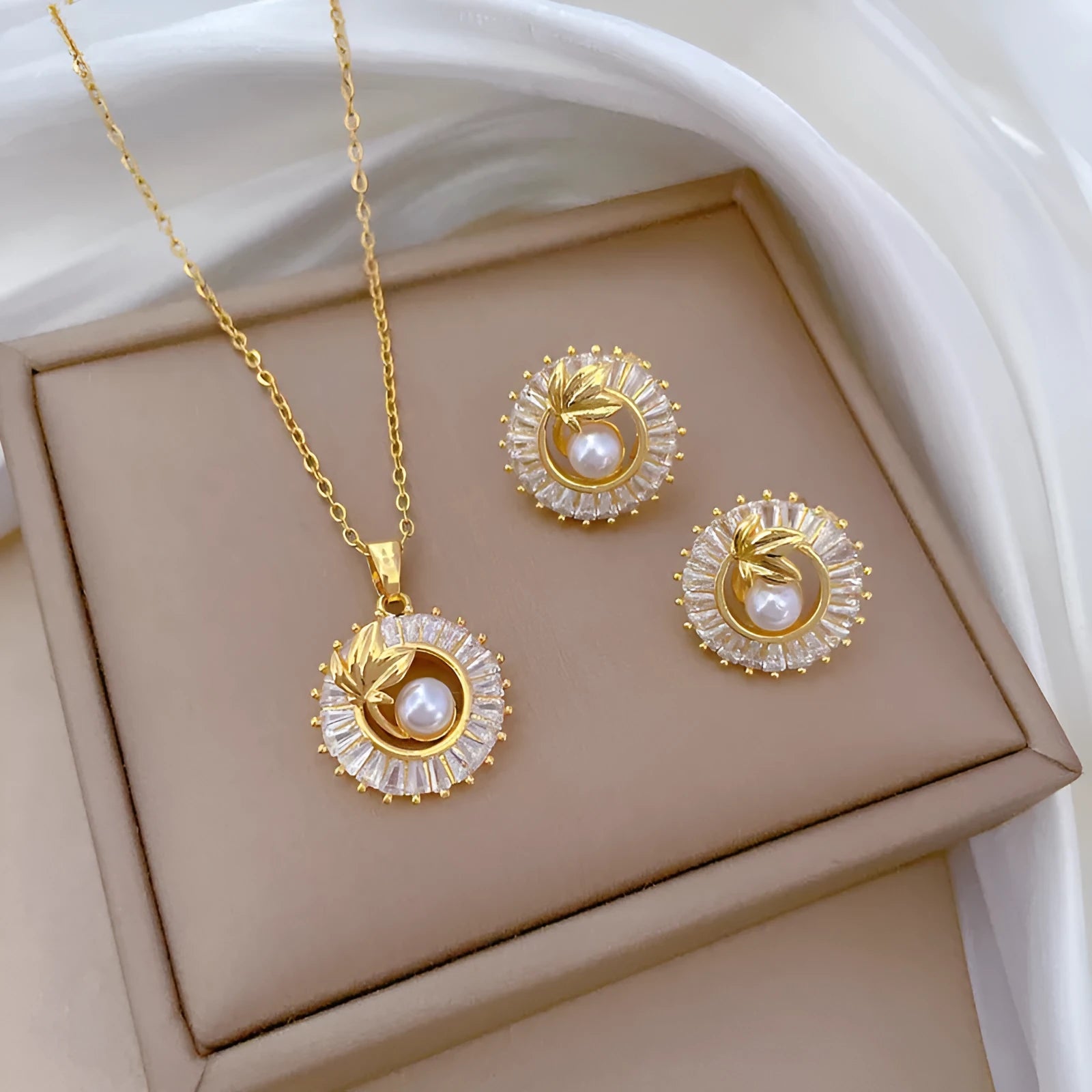 Women's titanium steel jewellery set with geometric leaf design necklace and matching earrings