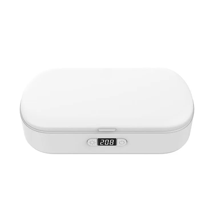 White portable UV steriliser box with wireless charging for phones and personal items