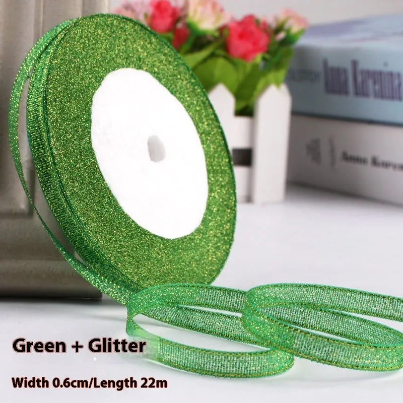 Roll of 0.6cm wide polyester gift ribbon in various colours including gold leaf, coffee and sky blue options