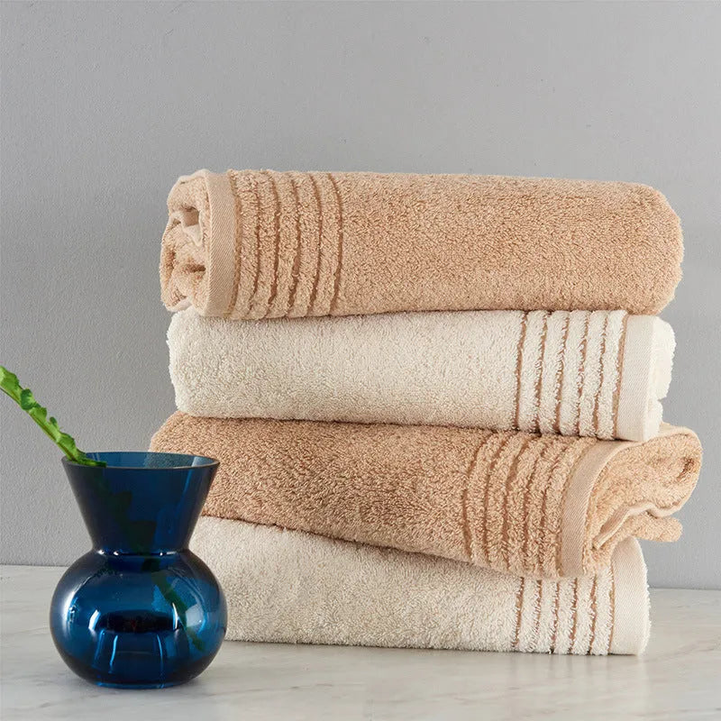 Cotton towel set in beige and brown with 395 GSM weight including bath towel, hand towel, and face cloth