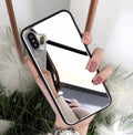 Black iPhone case with a built-in mirror on the back, compatible with iPhone X, 7, and 8 Plus models.