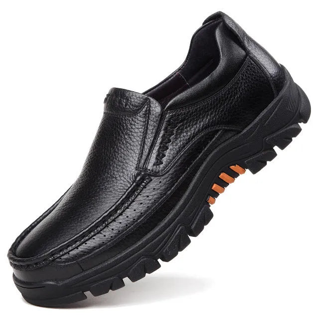 Men's black and brown cowhide leather business casual slip-on shoes with a rubber sole.