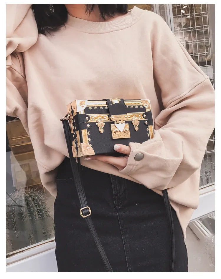 Women's black PU leather hard flap shoulder bag with decorative rivets and hasp closure