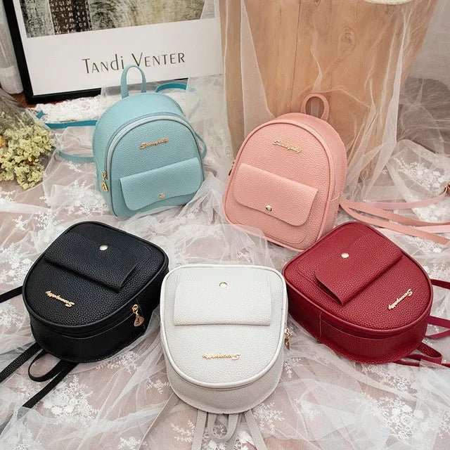 Women's small black PU leather backpack letter purse with shoulder strap measuring 18.5cm long