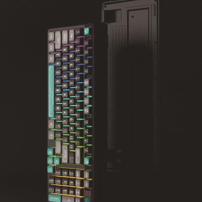 Luminous plastic computer keyboard in one of four colour combinations on a desktop.