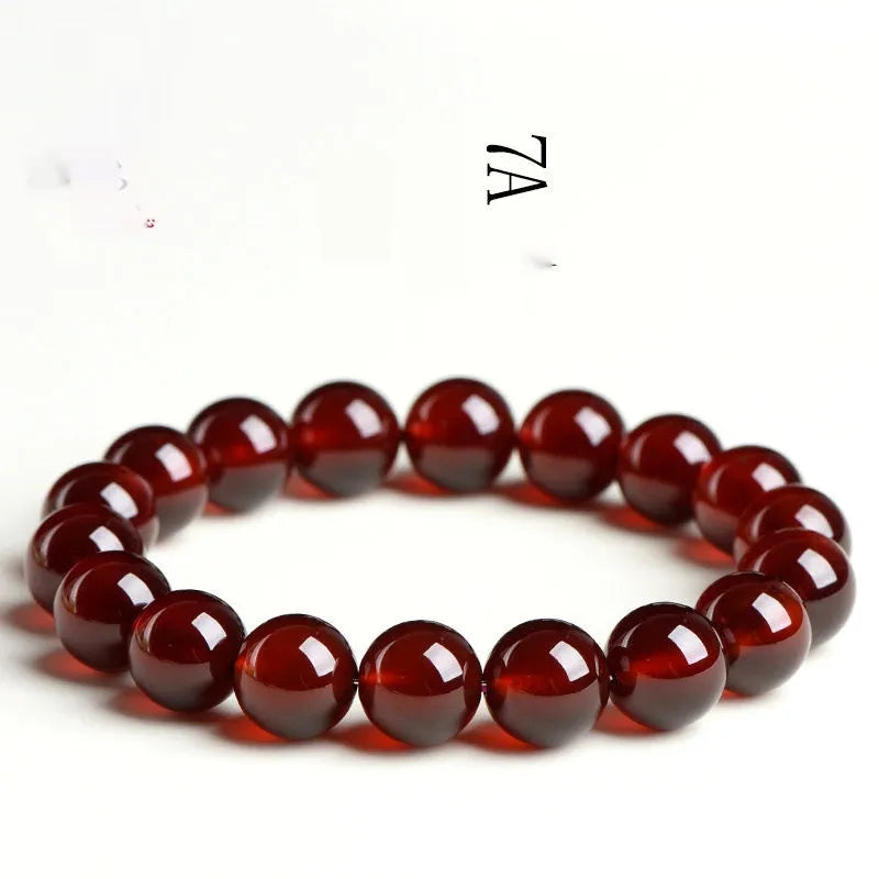 Natural orange red garnet ball crystal bracelet with Ruyi design in retro unisex style.
