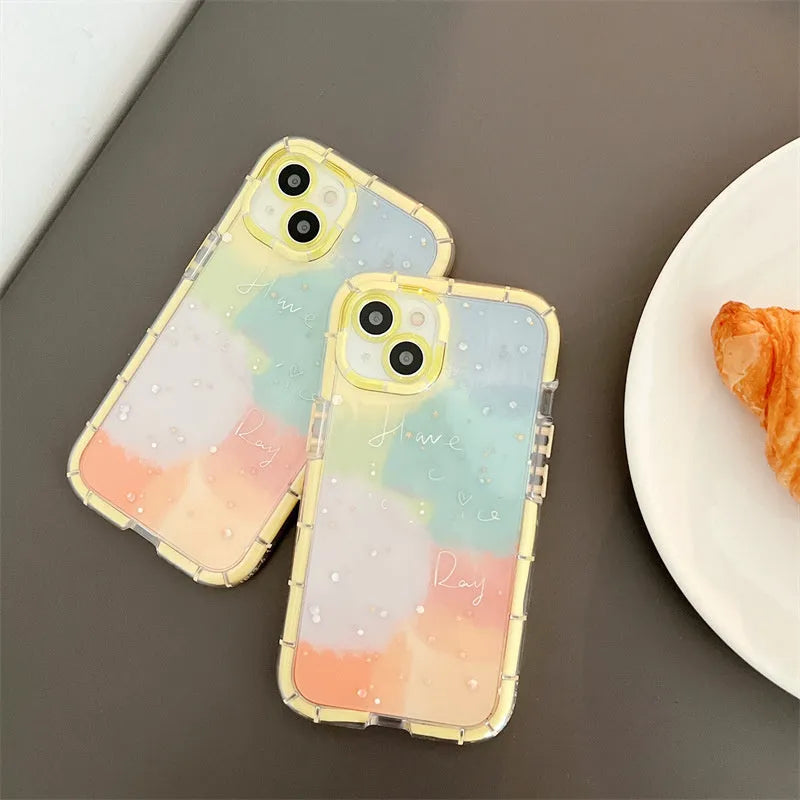Minimalist yellow-edged silicone phone case for iPhone 14 and other models on a table.