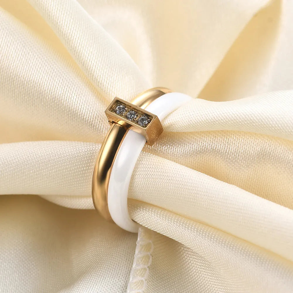 Ceramic women's ring with 6mm zirconium inlay in geometric design, available in steel black or gold white finishes