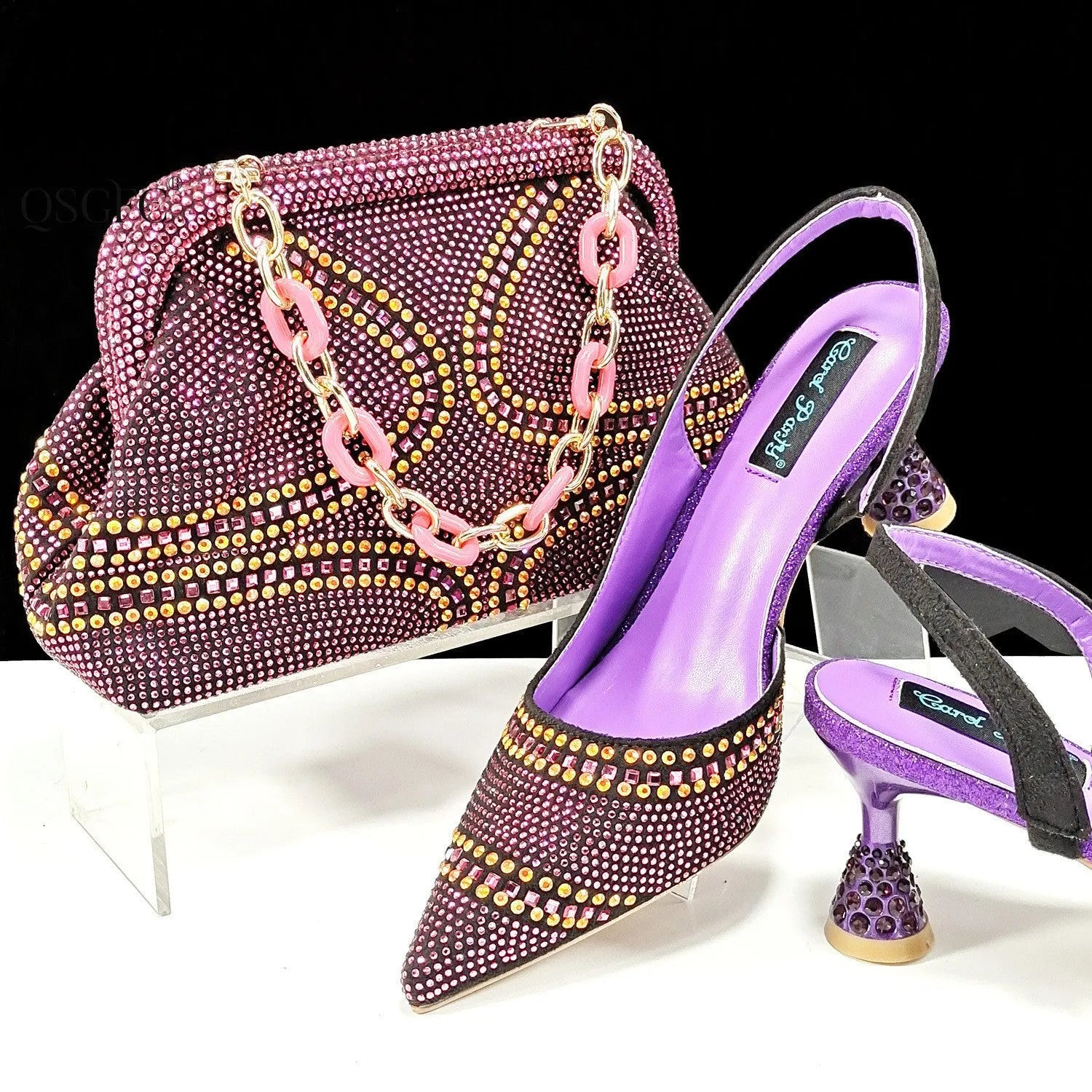 Women's pointed toe high heels with rhinestone details and matching small bag in synthetic leather