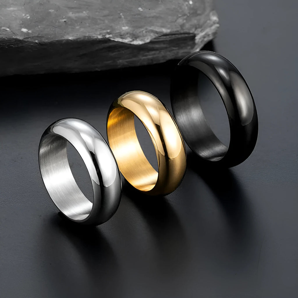 Glossy electroplated titanium steel ring in gold, black, or steel colour on a plain background.