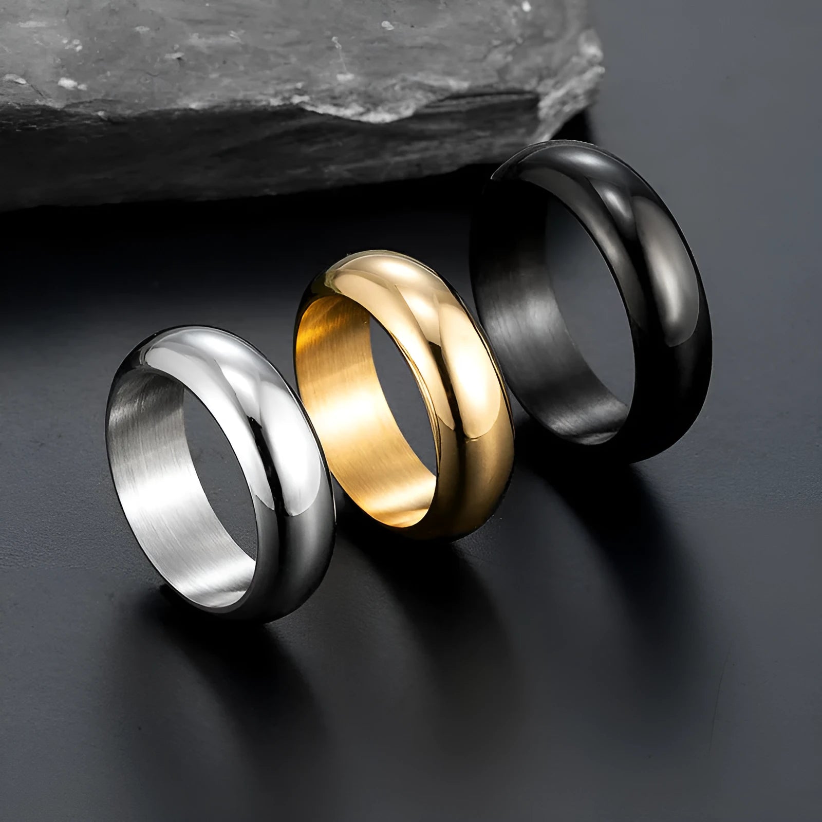 Glossy electroplated titanium steel ring in gold, black, or steel colour on a plain background.