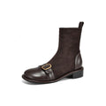 Black women's low heel martin boot with lace-up front and belt buckle stitching detail.