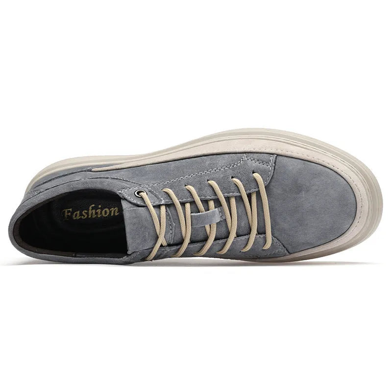 Men's grey casual skate shoes with pigskin upper and rubber sole showing lace-up front design
