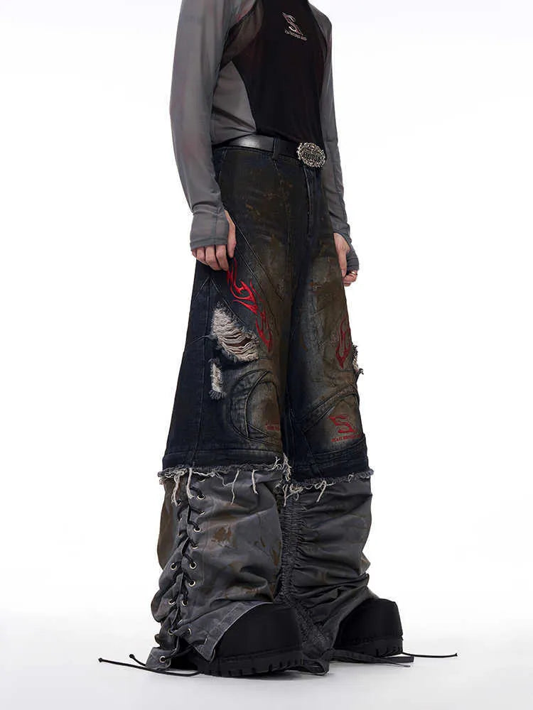 Men's retro denim jeans with detachable trouser legs in a wide leg, loose fit style.