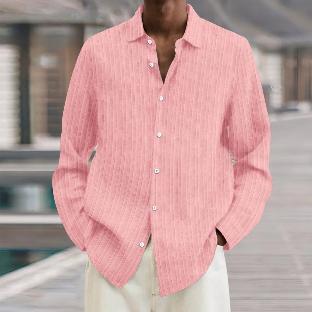 Man wearing a loose fit striped cardigan shirt in British style with a 3D pattern.