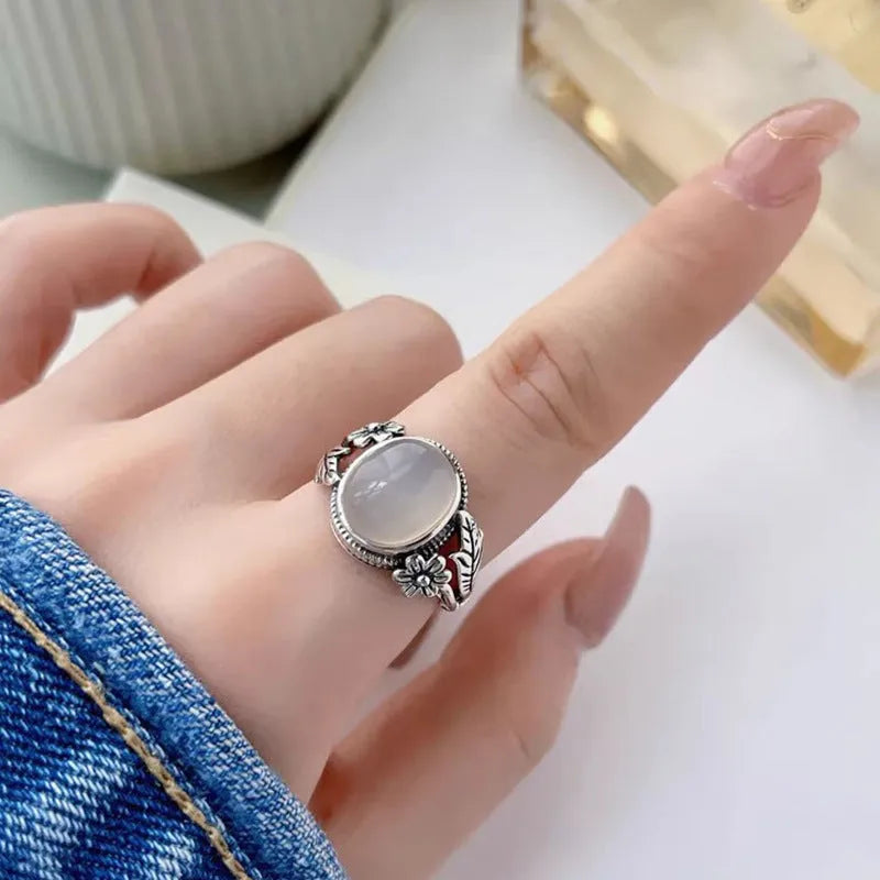Adjustable copper vintage ring with white chalcedony stone and U-shaped band.