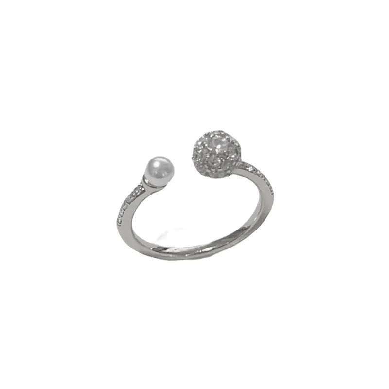 Adjustable open-end pearl ring with round zircon stone in gold or silver finish