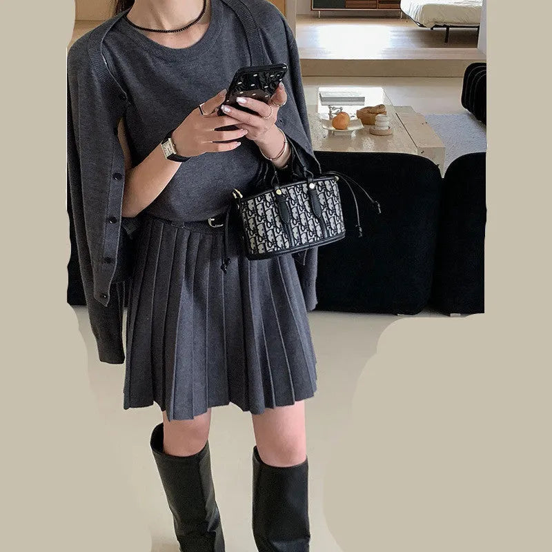 Women's grey knitted two-piece set with vest skirt and long-sleeved cardigan in art retro style