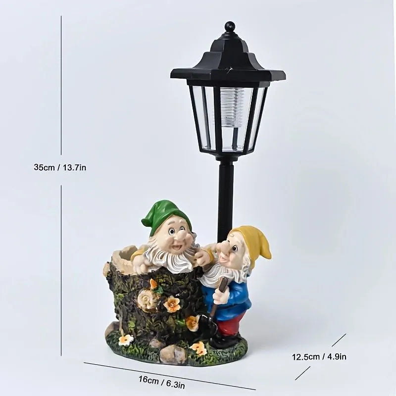Solar hexagonal garden lamp with decorative resin figurine on plastic base for outdoor pathway lighting