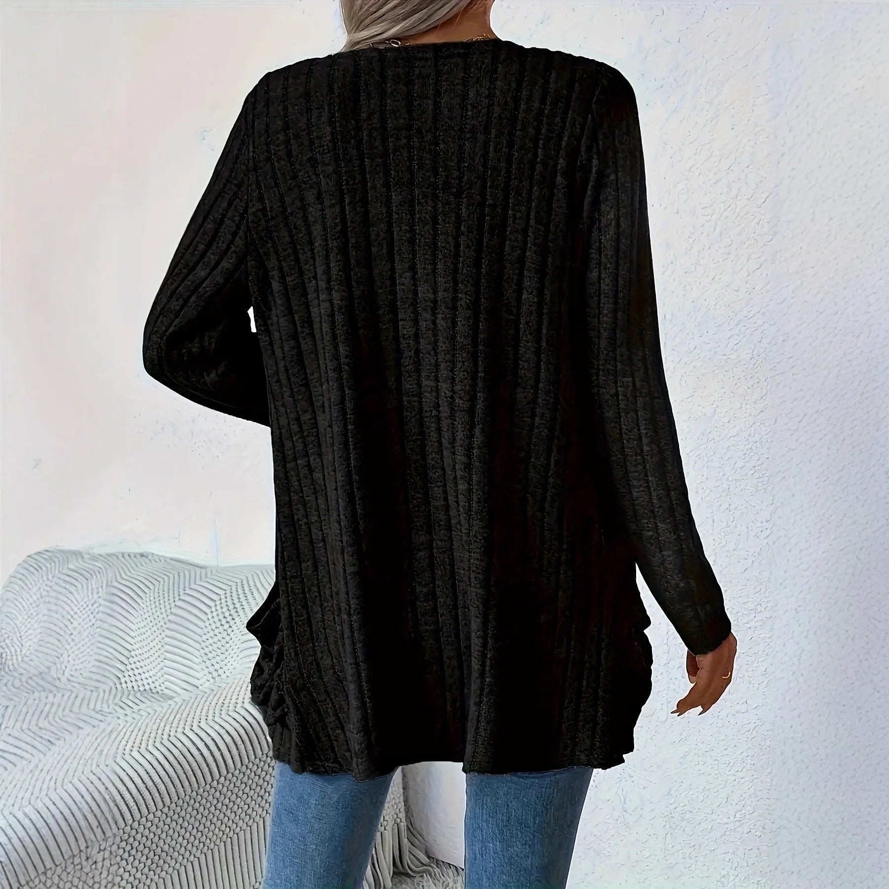 Solid colour loose fit long sleeve cardigan with front pocket in grey or black.