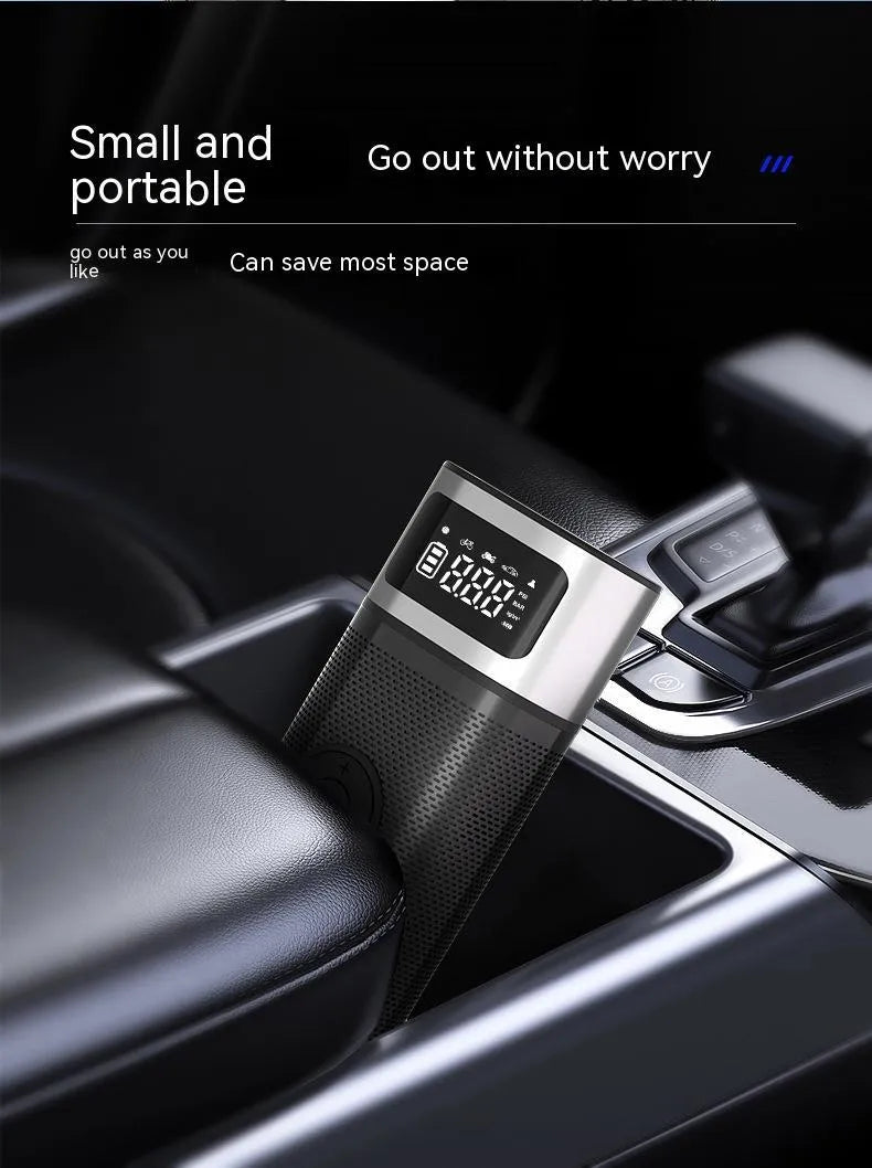 Black portable wireless air pump with metal construction, USB charging port, and 15cm inflation tube