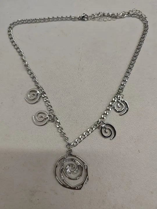 Geometric spiral donut jewellery set with necklace, bracelet, and earrings on adjustable 41-50cm chain