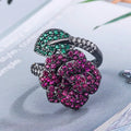 Gold-plated geometric flower ring with red simulated corundum stone on black gold band