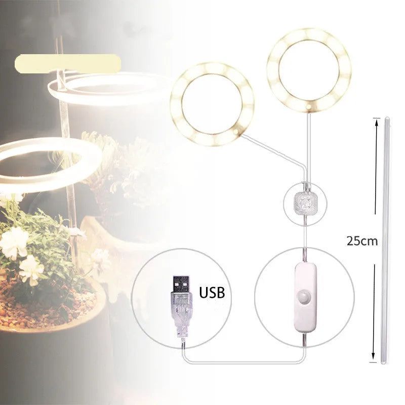 USB LED full spectrum plant grow light with acrylic stick on a table.