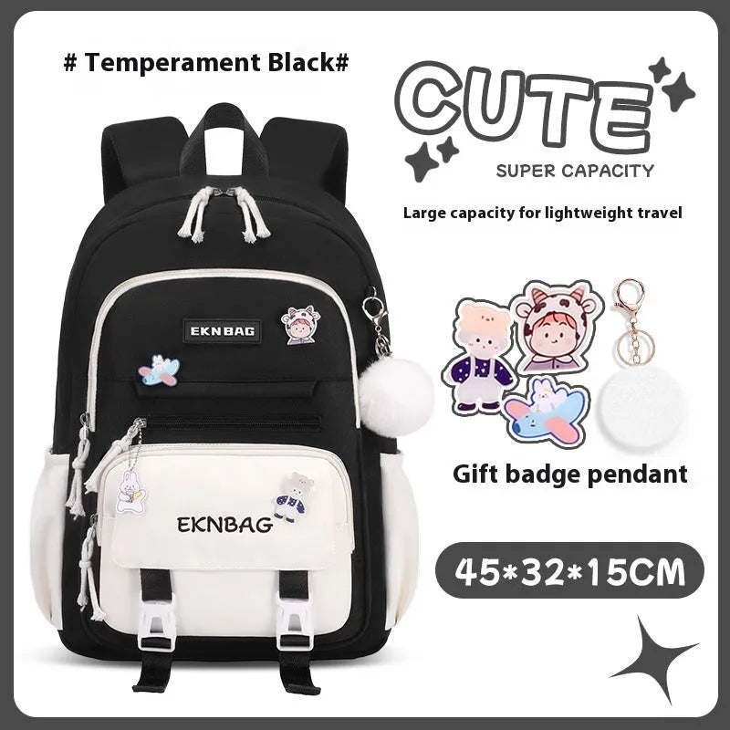 Pink waterproof Oxford cloth school backpack for girls with curved shoulder straps on a white background.