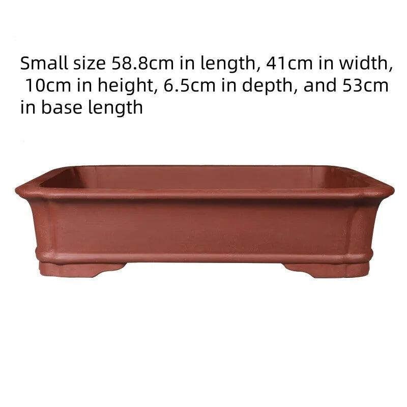 Large rectangular purple clay flowerpot for bonsai or plants, showing its handmade texture and substantial size.