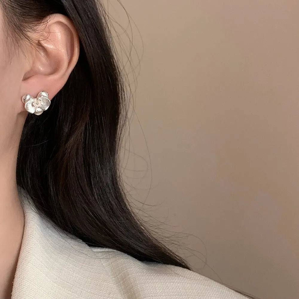 Retro flower earrings with petal detailing in gold or silver electroplated finish on copper